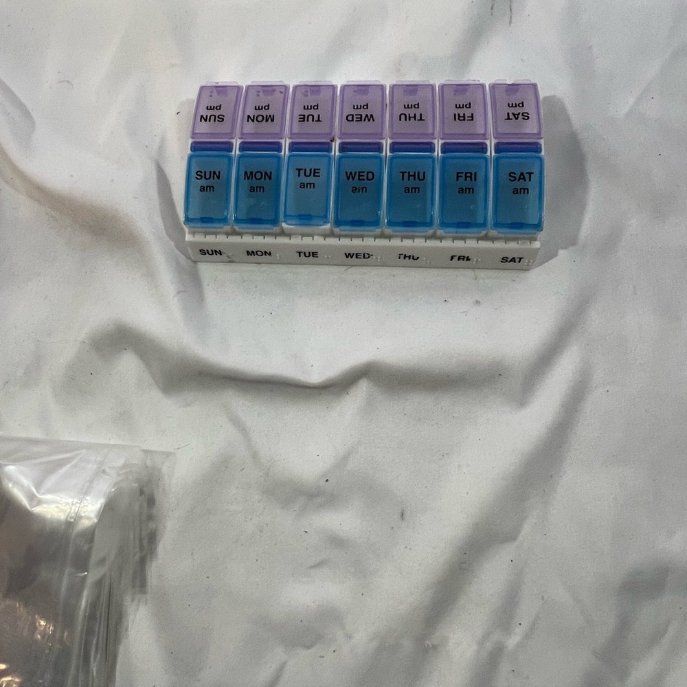 Weekly Pill Organizer with Purple and Blue Lids